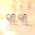 Stylish Silver Plated Hollow Heart Interlock Stud Earrings