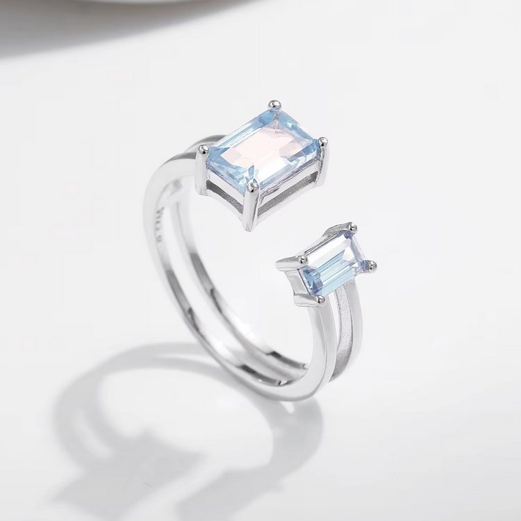 925 Sterling Silver Light Blue Emerald Cut Zirconia Adjustable Ring (Size 5.5-7)